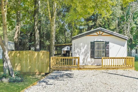 Front exterior with wraparound porch and extended driveway — plenty of space for boats, trailers, or multiple vehicles.