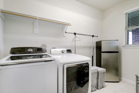 Samsung washer and dryer. Iron, steamer, ironing board, and detergent provided