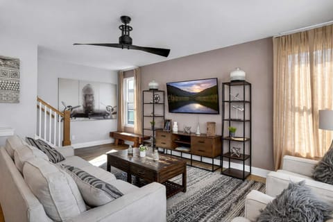 Bright and stylish living room with comfortable seating, perfect for relaxing, entertaining, and gathering with friends and family.