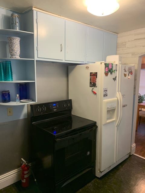Glass top electric stove ,  refrigerator with water and ice access on door. 