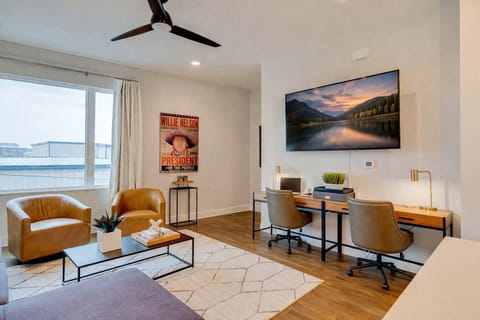 Comfortable living area with a dedicated workspace, perfect for remote work, extended stays and relaxing.
