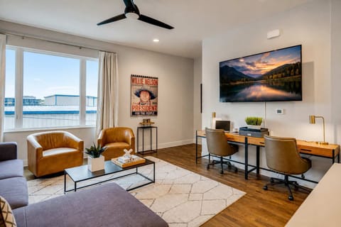Comfortable living area with a dedicated workspace, perfect for remote work, extended stays, and relaxing.