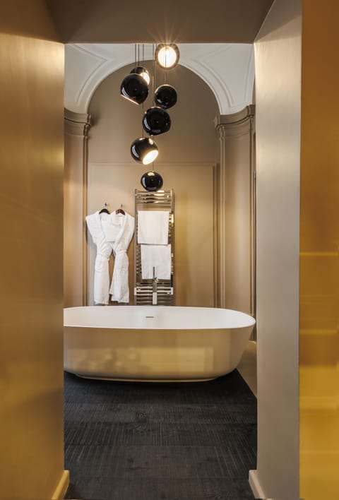 Junior Suite | Bathroom | Rainfall showerhead, designer toiletries, hair dryer, bathrobes