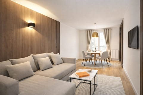 Cozy living room setup with a flat-screen TV and complimentary Wi-Fi for entertainment and connectivity.