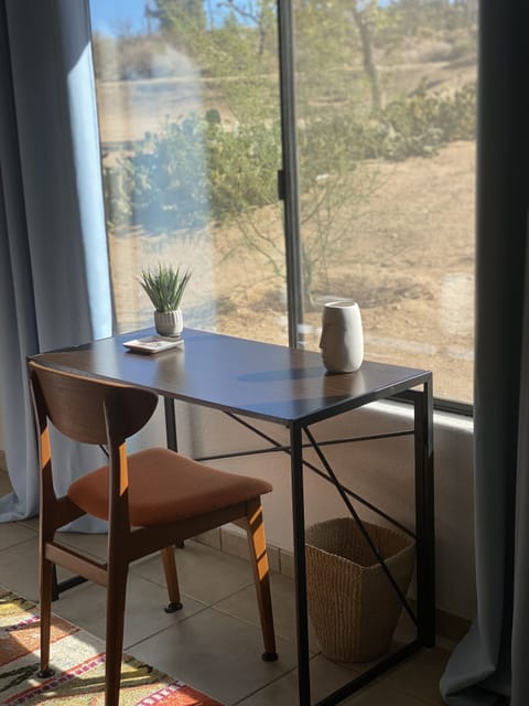 desk in master bedroom with view of the mountains