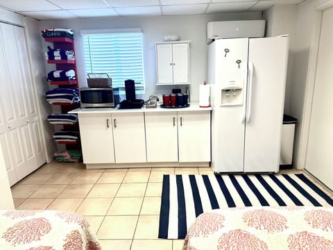 Kitchenette downstairs. Microwave, coffee maker, refrigerator.
