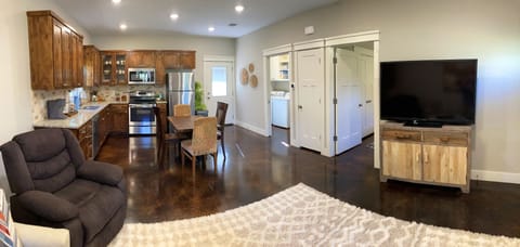 From the front window looking toward the kitchen. Bedroom is first door on right