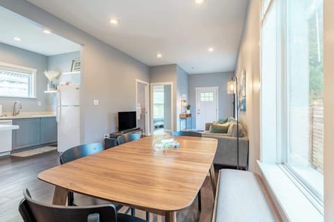 Modern, airy layout with large windows and comfortable seating throughout.