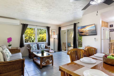 Townhome, Multiple Beds, Patio, Garden View (Surf & Racquet Club #24) | Living area | 42-inch flat-screen TV with digital channels