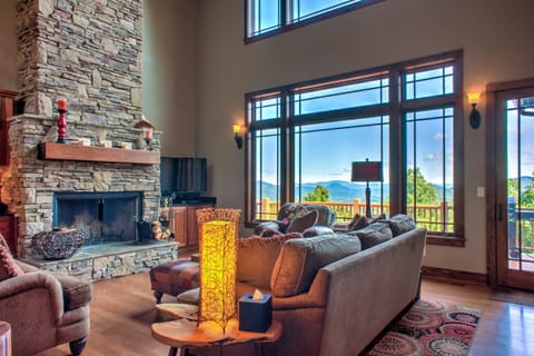 Living Area w/ Wood Fireplace, Vaulted Ceilings & Mountain Views