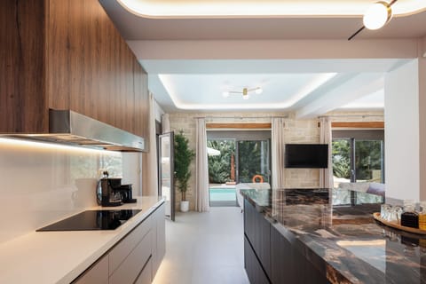 It has four ceramic hobs, a refrigerator, an electric oven, and a microwave oven and a wine cooler, offering a unique dining experience for all meal