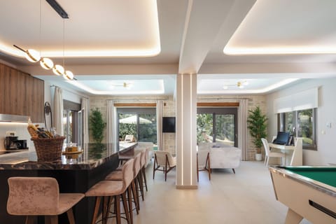 Open plan living - kitchen area with direct access to the pool and garden