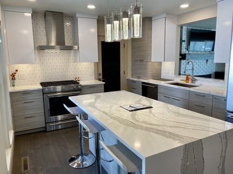 Kitchen with waterfall counter on island 