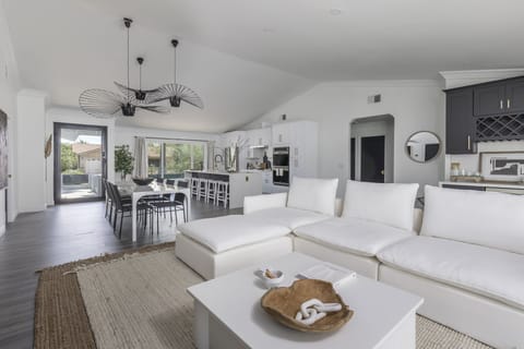 Bright living room with large flat screen TV