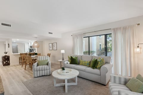 Beautifully Decorated Living and Dining Space Flooded with Sunshine