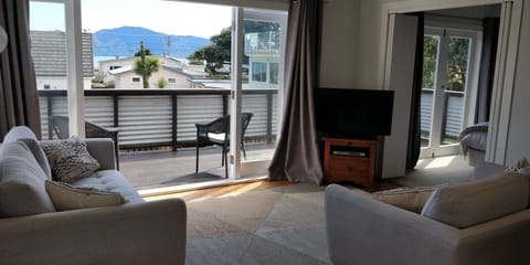 Living room faces the sun, sea, and island.