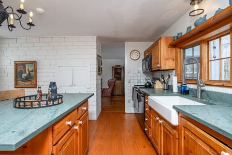 Welcome to our spacious wooden-inspired kitchen area, where rustic charm meets modern convenience.