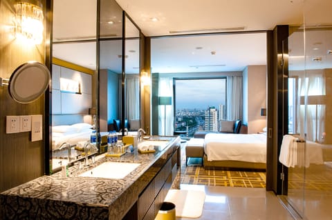Regency, Suite, 1 King Bed | Bathroom | Combined shower/tub, rainfall showerhead, hair dryer, bathrobes