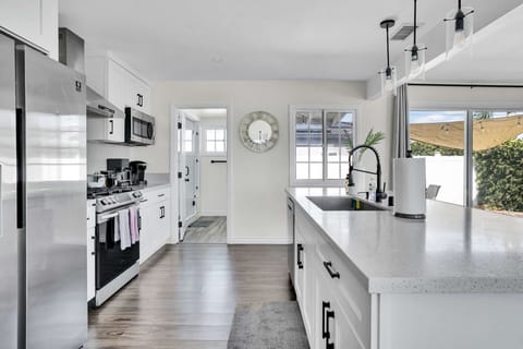 Fully equipped kitchen with stainless steel appliances and plenty of counter space.