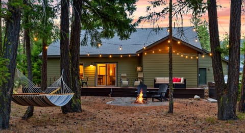 Backyard: Dining table, seating area, hot tub, wood fire pit