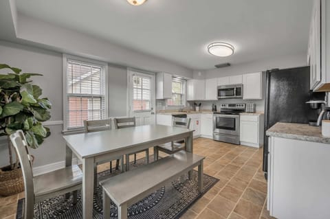 Welcome to our beautifully remodeled Airbnb kitchen, fully stocked for all your cooking needs. The modern design features sleek countertops and state-of-the-art appliances. Everything from the pots and pans to the spices are provided, making it easy to whip up a delicious meal.