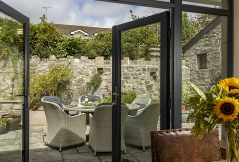 Double doors leading out onto the beautiful courtyard garden