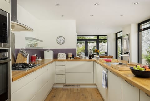 Ground floor: Open-plan living space with well-equipped kitchen, dining and seating area