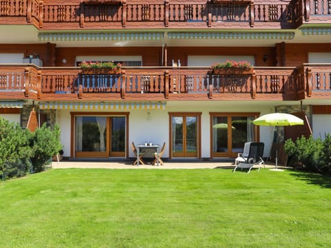 Plant, Building, Window, Leisure, Umbrella, Real Estate, Facade, Outdoor Furniture, Grass, Chair
