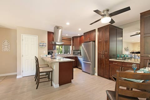 Updated kitchen with new appliances and well stocked with cooking essentials
