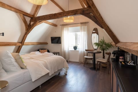 Cozy double bed in romantic attic room