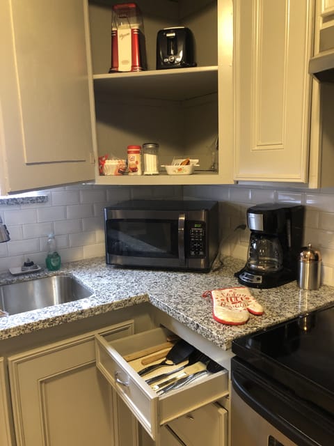 Microwave and coffee pot. Coffee, creamer, sugar, tea and cocoa provided