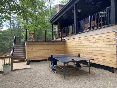 Outdoor Space - Blue Haven Lake House has a wonderful outdoor space. You can participate in ping pong or enjoy the nice Alabama weather on the plentiful seating!