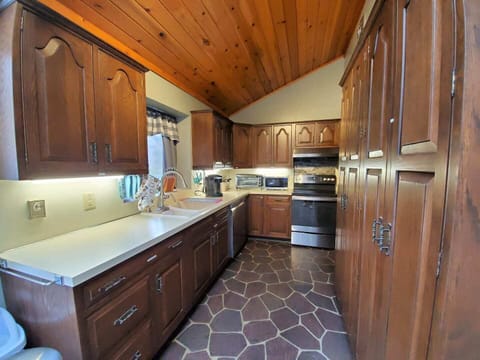 A kitchen with fully equipped utensils.