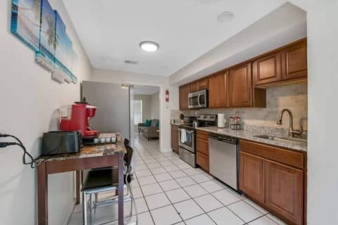 Our kitchen has a full set of appliances, including a Keurig coffee maker and basic kitchen utensils. 