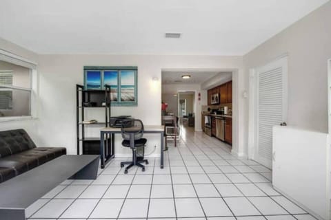 Office area with desk and seating area. 