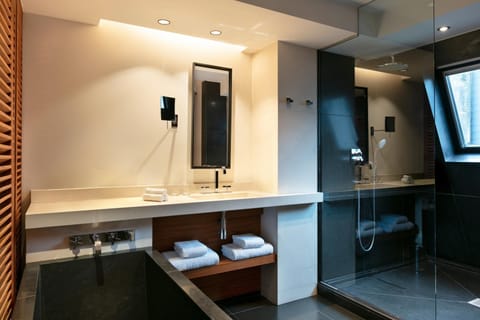 Combined shower/tub, designer toiletries, hair dryer, bathrobes