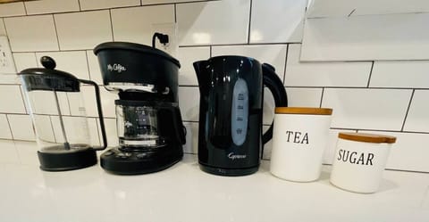 We provide coffee, tea & raw sugar. We also provide a French press, a small & large drip coffee maker & an electric tea kettle.