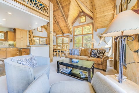 Spacious living area with gas fireplace, flat screen TV, vaulted ceilings, ample seating and breathtaking views plus great lighting from the large windows.