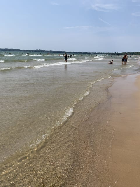Beach nearby, white sand, rowing