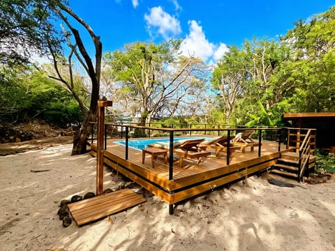 Beautiful pool deck where you can lay and sunbathe while overlooking nature
