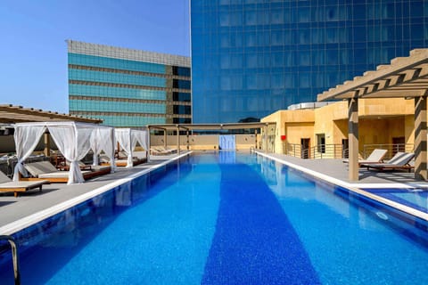Outdoor pool, pool umbrellas, sun loungers