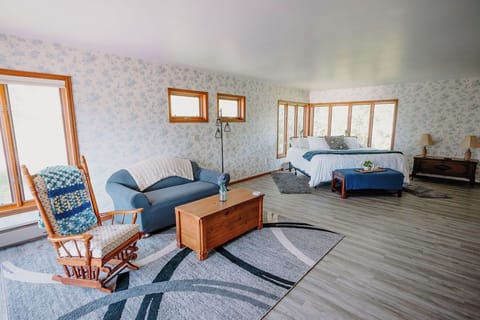 The upstairs main bedroom. Seperated from the seating area with room dividers. 