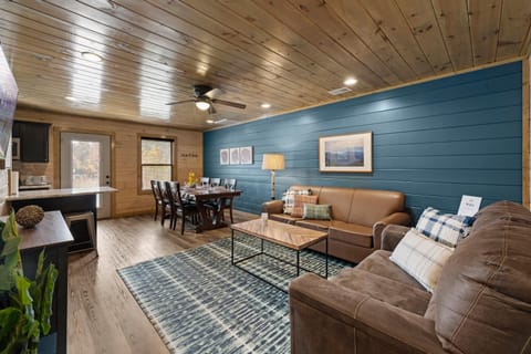 Each side of the duplex cabin features an open-concept living room, dining room, and kitchen to give guests a common area in which they can relax together.