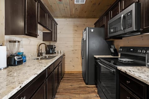 Each kitchen is fully stocked with dishes, pots, pans, stainless steel appliances. Both a drip coffee maker and Keurig are at your service! A charcoal BBQ grill is available out back of each unit. High chairs and children's dinnerware are provided.