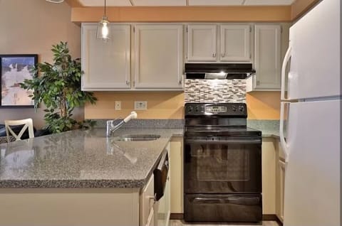 Kitchen with full size fridge, oven, dishwasher and microwave 