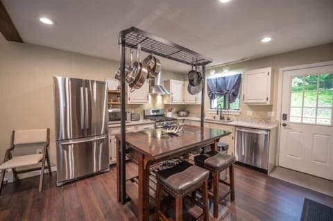 Brand new SS appliances in this updated kitchen open to the living area.