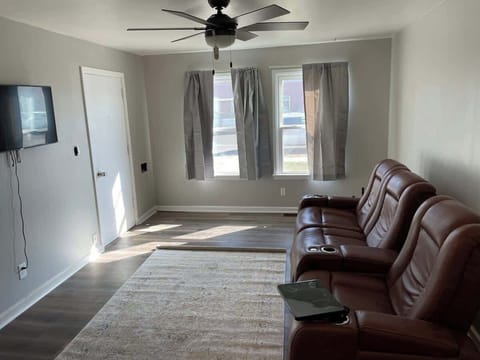 Spacious living room. Couch is motorized reclining. Roku tv.