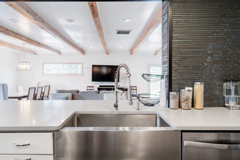 Kitchen sink open to the grand room