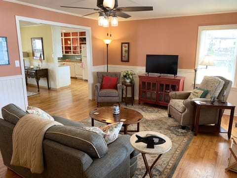 Living Room with comfy seating areas and a Smart TV, ready for streaming.