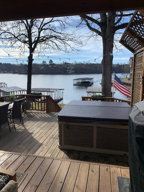 Private hot tub on back deck with view of Lake Hamilton. 